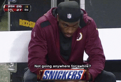 Man On Bench With Snickers Bar GIF