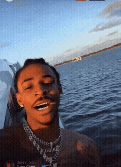Man On Boat With Darreal Bill Necklace GIF