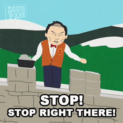 Man On Brick Wall Saying Stop Right There GIF