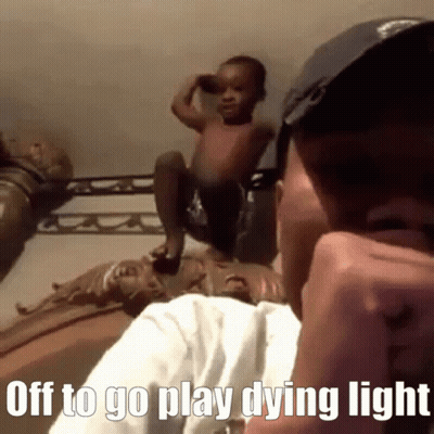Man On Cell Phone With Baby Saying Off To Go Play Dying Light GIF