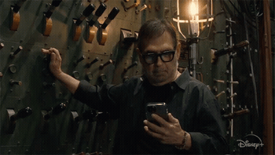 Man On Cell Phone With Disney+ GIF