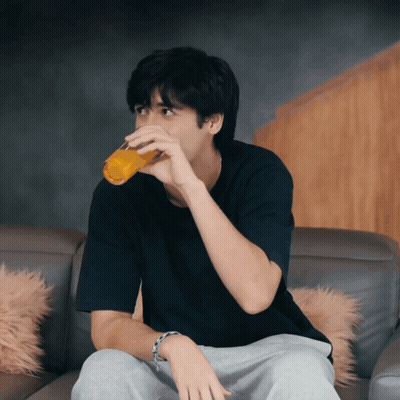 Man On Couch Drinking Orange Juice GIF
