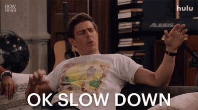 Man On Couch Saying Ok Slow Down GIF