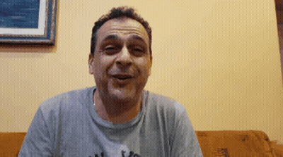 Man On Couch Wearing I Love You Grey Shirt GIF
