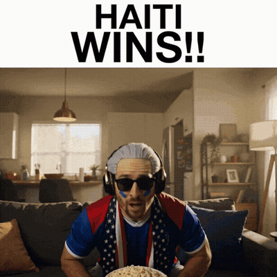 Man On Couch With Bowl Of Popcorn Haiti Wins GIF