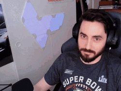 Man On Earphones Feeling Intrigued GIF