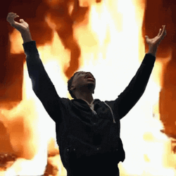 Man On Fire Arms Up Fiery Background GIF