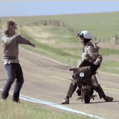 Man On Motorcycle Pushed By Another Person GIF