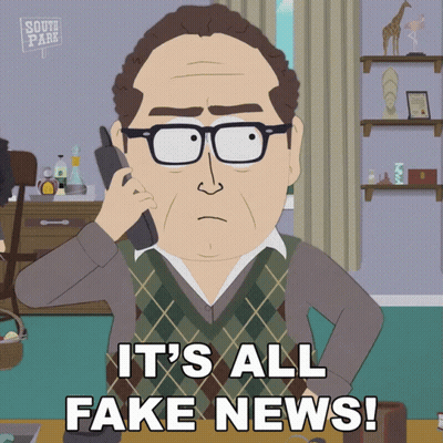 Man On Phone Saying It's All Fake News GIF