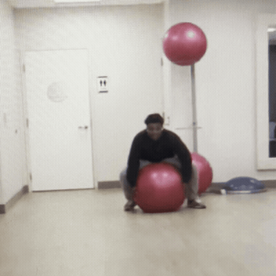 Man On Pink Exercise Ball By T & T Sign GIF
