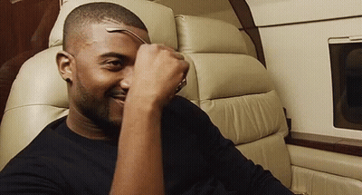 Man On Plane Holding Glasses GIF