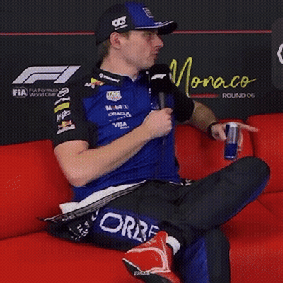 Man On Red Couch Holding Red Bull And Microphone Saying You Wait One Second GIF