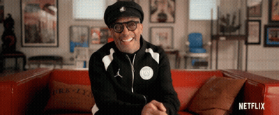 Man On Red Couch With Brooklyn Pillow GIF