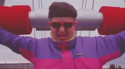 Man on Roller Coaster in Pink Purple Jacket Sunglasses