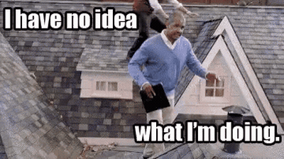 Man On Roof Holding Book And Tablet GIF