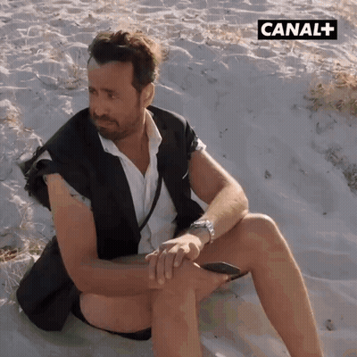 Man On Sandy Beach With Canal + GIF