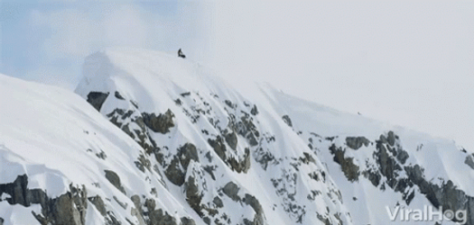 Man On Snowmobile Jumping Off A Cliff GIF