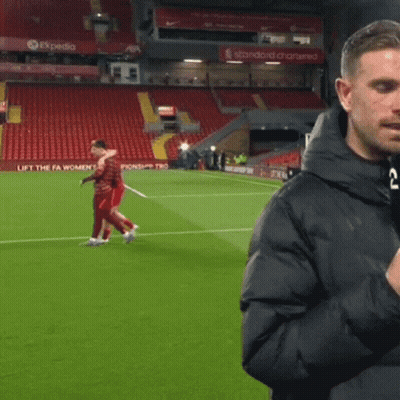 Man On Soccer Field In Front Of Expedia Sign GIF