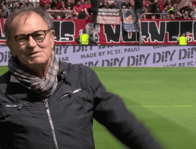 Man On Soccer Field In Front Of Made By FC St. Pauli Banner GIF