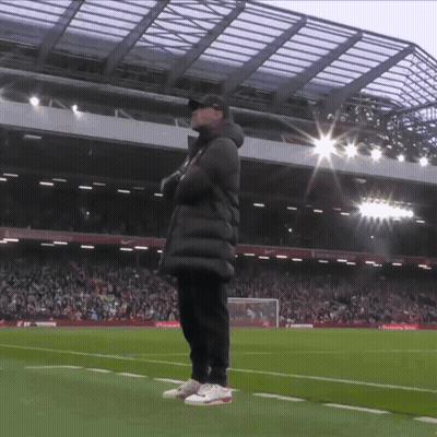 Man On Soccer Field In Front Of Stadium GIF