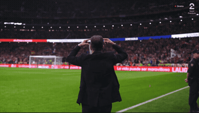Man On Soccer Field With Arms Outstretched In Front Of LG Ad GIF