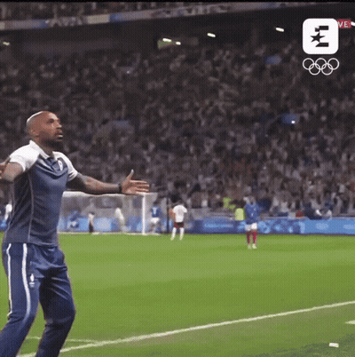 Man On Soccer Field With Olympic Logo GIF