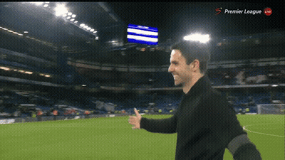 Man On Soccer Field With Premier League Screen GIF