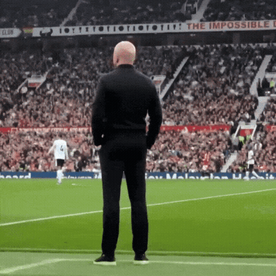 Man On Soccer Field With Sign Saying The Impossible GIF