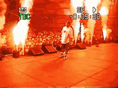 Man On Stage Before Crowd With TBC And SP GIF