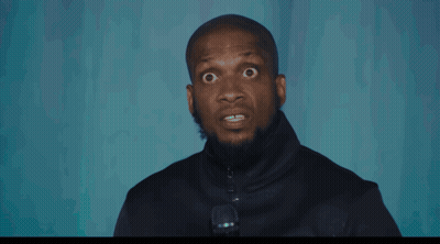 Man On Stage Holding Microphone GIF