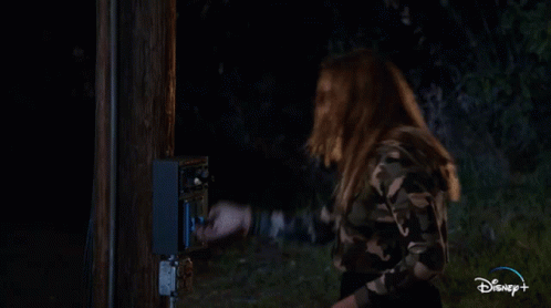 Man On Stage In Front Of Camp Shaky Lake Sign GIF
