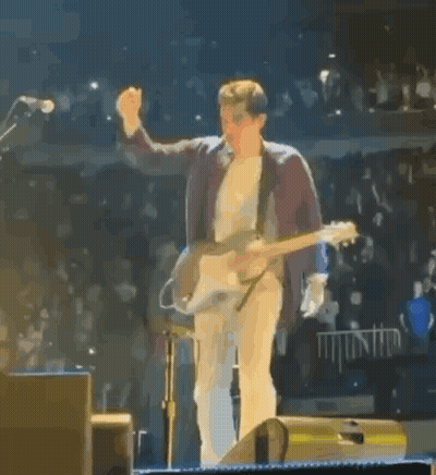 Man On Stage Playing Guitar Giving Middle Finger GIF
