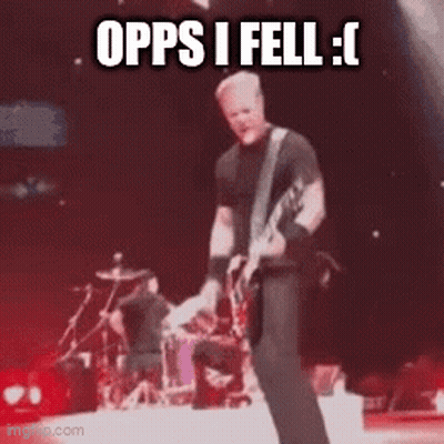 Man On Stage Playing Guitar Saying Opps I Fell GIF