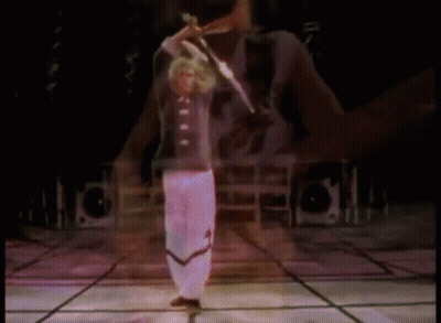Man On Stage With Arms Outstretched Before Crowd GIF