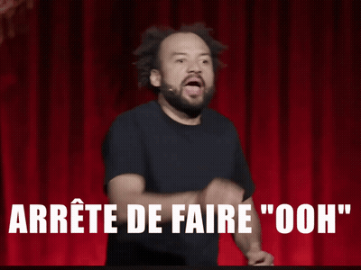 Man On Stage With Fist In Air Saying Arrête De Faire Ooh GIF