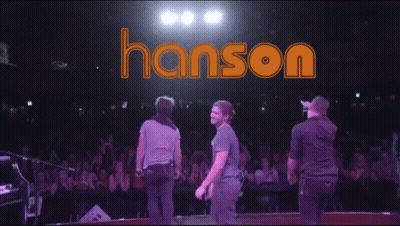 Man On Stage With Hanson Background GIF