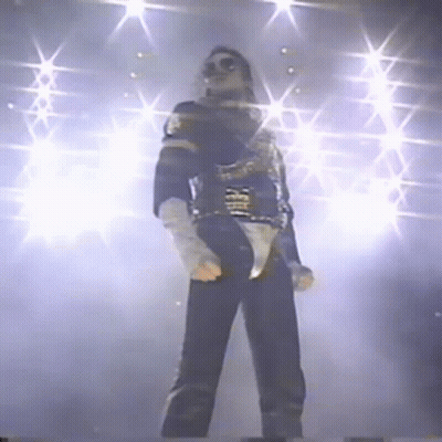 Man on Stage With Microphone and Lights
