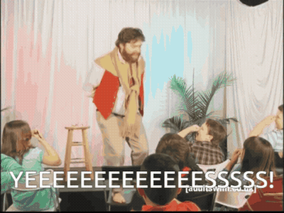 Man on Stage Yelling Yeeeeeeeeeeesss to Children
