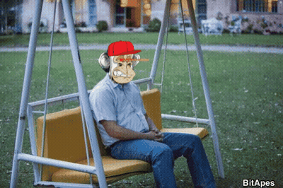 Man On Swing With Monkey On Face GIF