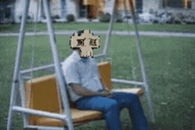 Man On Swing With Pixelated Skull GIF