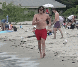 Man On The Beach Power Walking GIF
