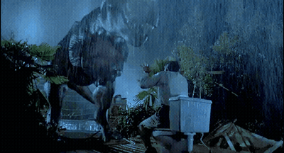 Man On Toilet Attacked By Dinosaur In Rain GIF
