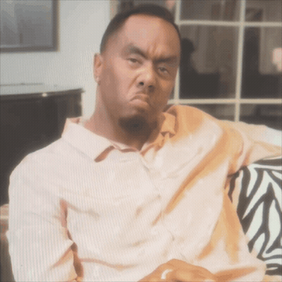Man On Zebra Print Couch Making Funny Face GIF