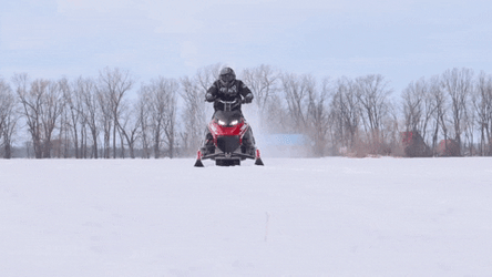 Man Operating A Snowmobile Front View GIF