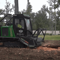Man Operating Machine To Produce Mulch GIF