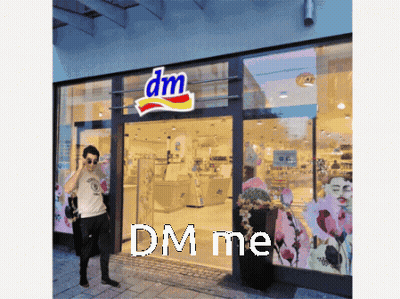 Man Outside DM Store Talking On Cell Phone GIF