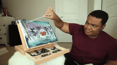 Man Painting On Easel With Brush GIF