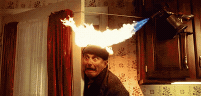 Man Peeking From Behind Door With Flame On Head GIF
