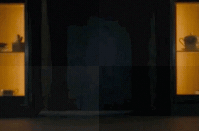 Man Peeking From Dark Room GIF