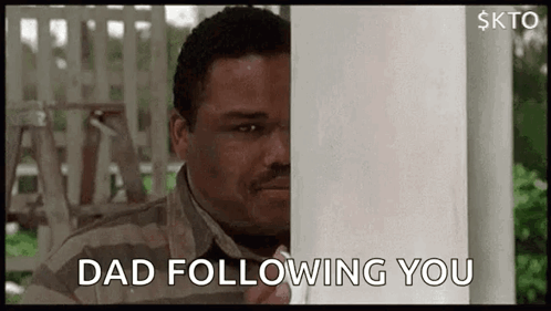 Man Peeking Out Behind Post Dad Following You GIF